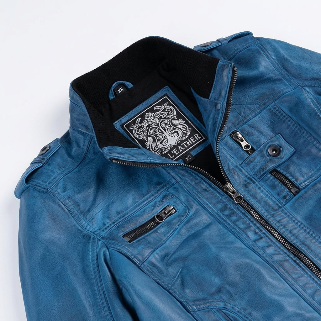 Women's blue waxed lambskin leather biker jacket front view showing ribbed collar and zipper pockets.