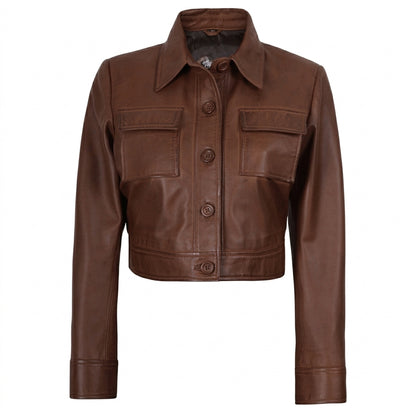 Women's cropped brown leather trucker jacket front view showing button-down closure and chest flap pockets.