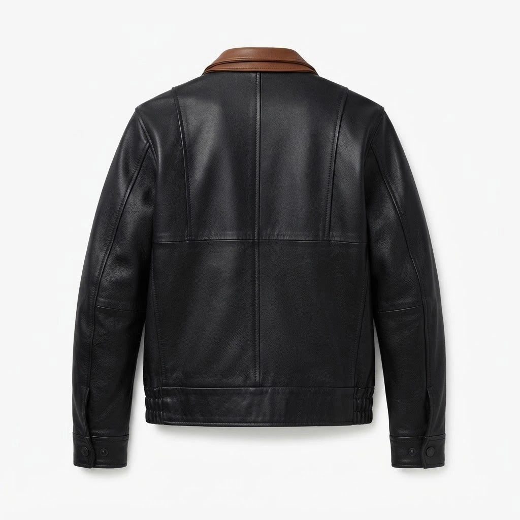 Alfred Black Leather Bomber Jacket front view featuring genuine black leather, contrasting brown inner collar, dual zip and snap closure, and ribbed hem