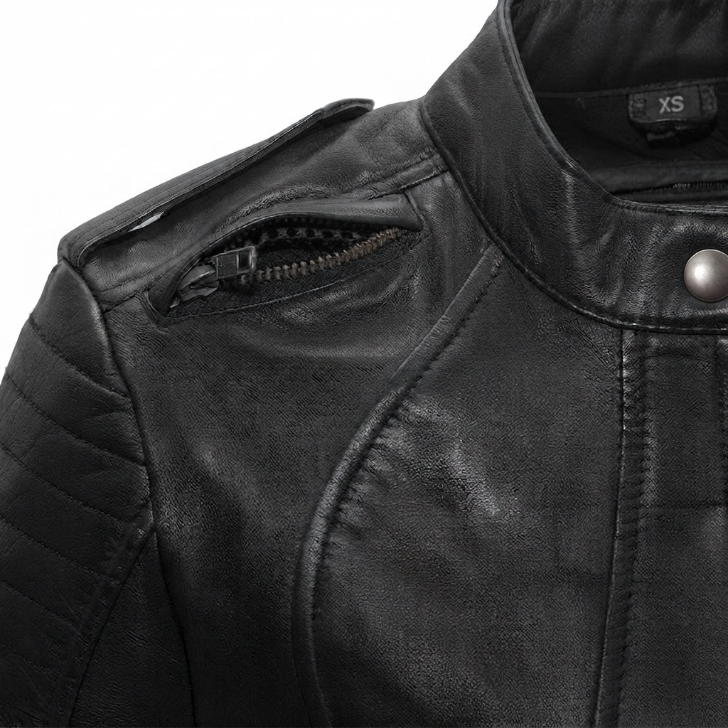 Biker women's motorcycle leather jacket front view showing mandarin snap collar, quilted sleeves, and black leather finish.