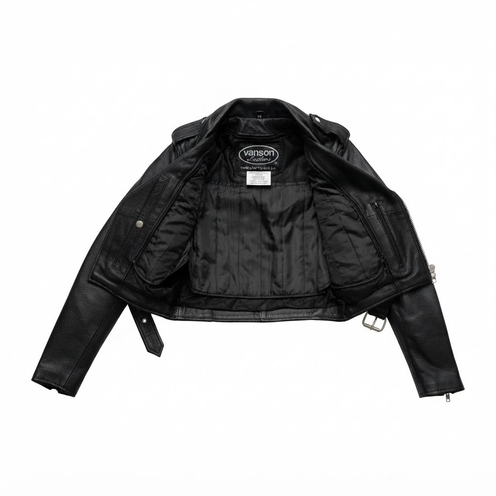 Imogen women's motorcycle leather jacket front view showing asymmetric zipper, waist belt, lapel snaps, and black leather finish.