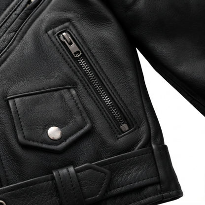 Imogen women's motorcycle leather jacket front view showing asymmetric zipper, waist belt, lapel snaps, and black leather finish.