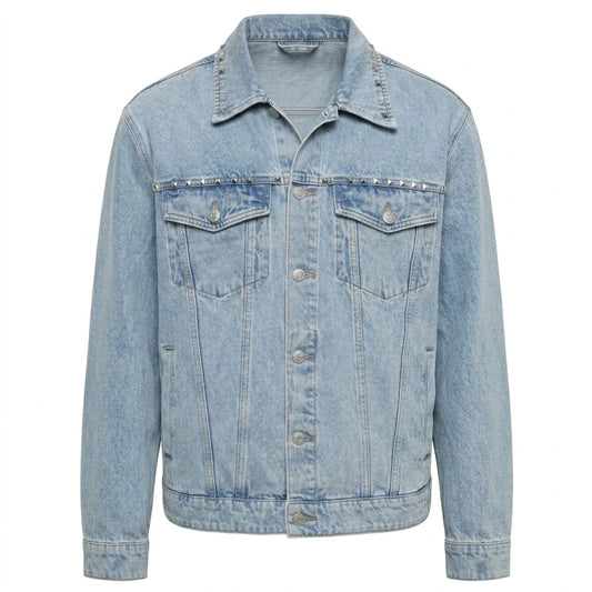 Not the Bad Guy Studded Trucker Jacket front view featuring light blue washed cotton denim, silver pyramid studs on collar and chest yoke, and button front   