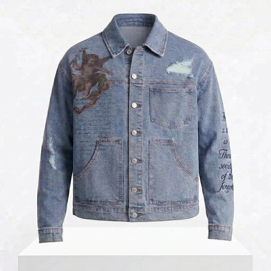 Scripted Streets Denim Trucker Jacket front view featuring light blue washed cotton denim, graphic art chest print, sleeve script lettering, and button front   