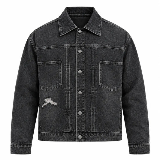 Underground Distressed Trucker Jacket front view featuring washed black denim, open chest patch pockets, distressed tear, and button front