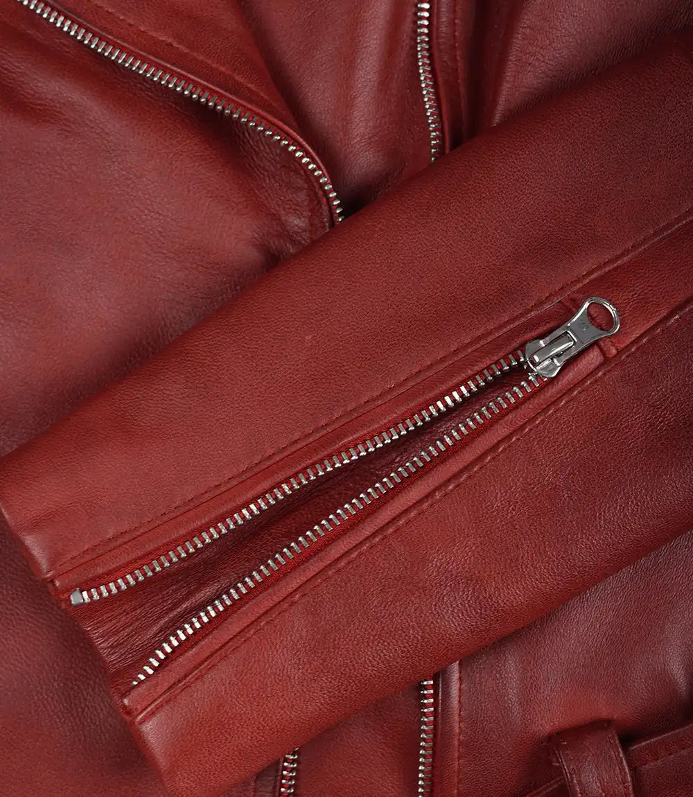 Women's red asymmetrical padded leather biker jacket front view showing quilted shoulder details and asymmetric zipper.